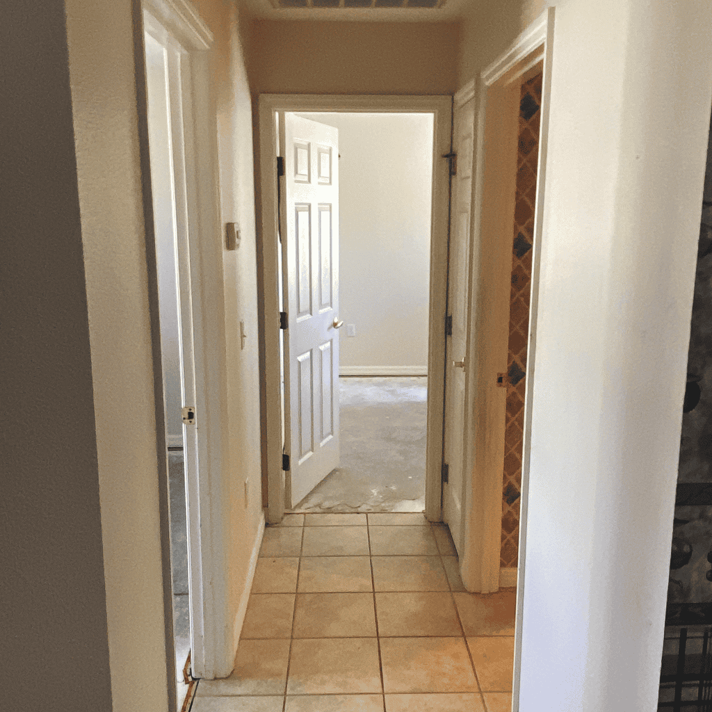 Water damage restoration damaged flooring and door frames after a leak repair. Expert service by A+ Integrity Restoration restores homes with quality water and flood damage repair.