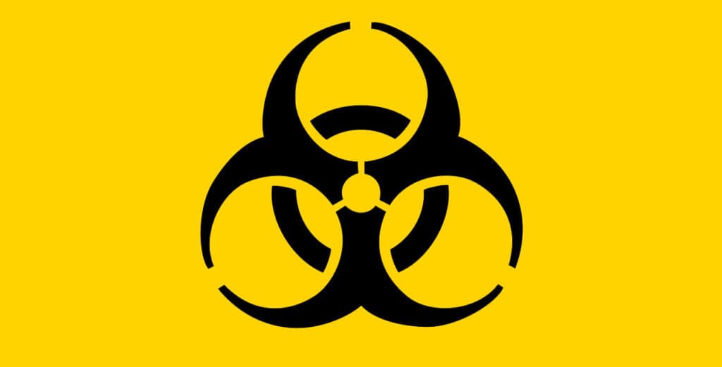 Biohazard warning symbol on yellow background, representing contamination, hazardous materials, or biohazard cleanup services by A+ Integrity Restoration.