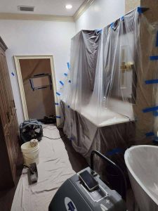 Comprehensive fire and water damage restoration services for homes, including mold removal and property cleanup by A+ Integrity Restoration. Disaster restoration process with protective plastic coverings, dehumidifiers, and professional equipment at a residential property by A+ Integrity Restoration.