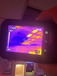 Indoor thermal scan illustrating roof and ceiling temperature differences to identify leaks, insulation issues, or water damage for restoration services. Thermal imaging of a building ceiling showing temperature variations for inspection and damage detection by A+ Integrity Restoration.